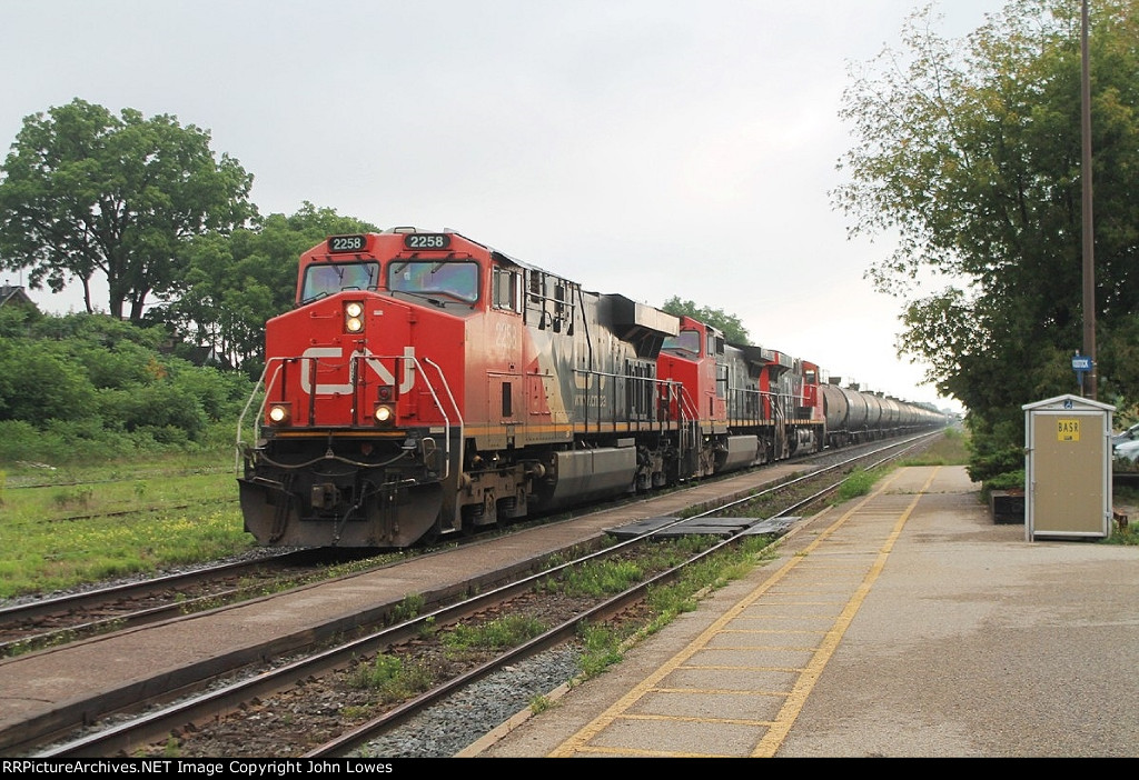 Westbound mixed freight races through the station